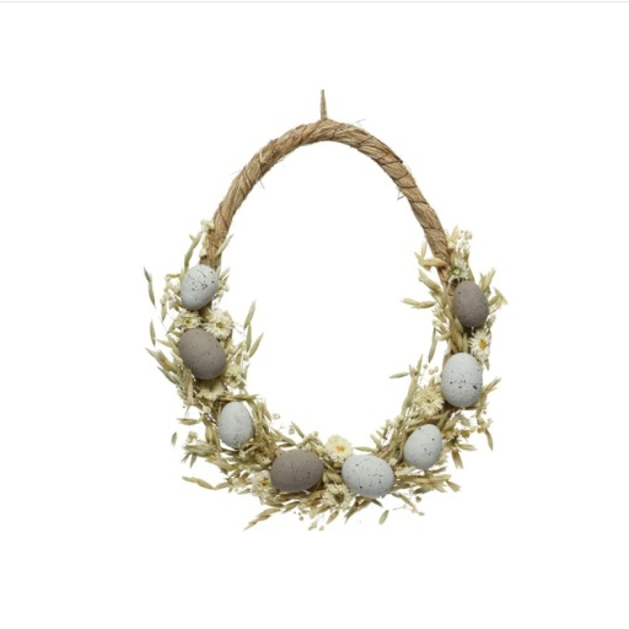 Coroniță de Paste decorată cu elemente naturale uscate. Are dimensiunile de 6x30x35 cm.