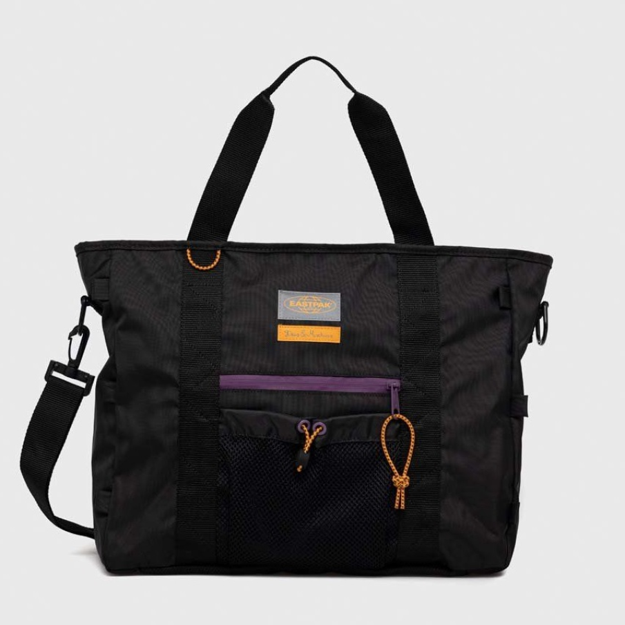 Geantă din colecția Deus Ex Machina, din material textil, cu buzunare în față. Are o curea atașabilă cu reglare.  