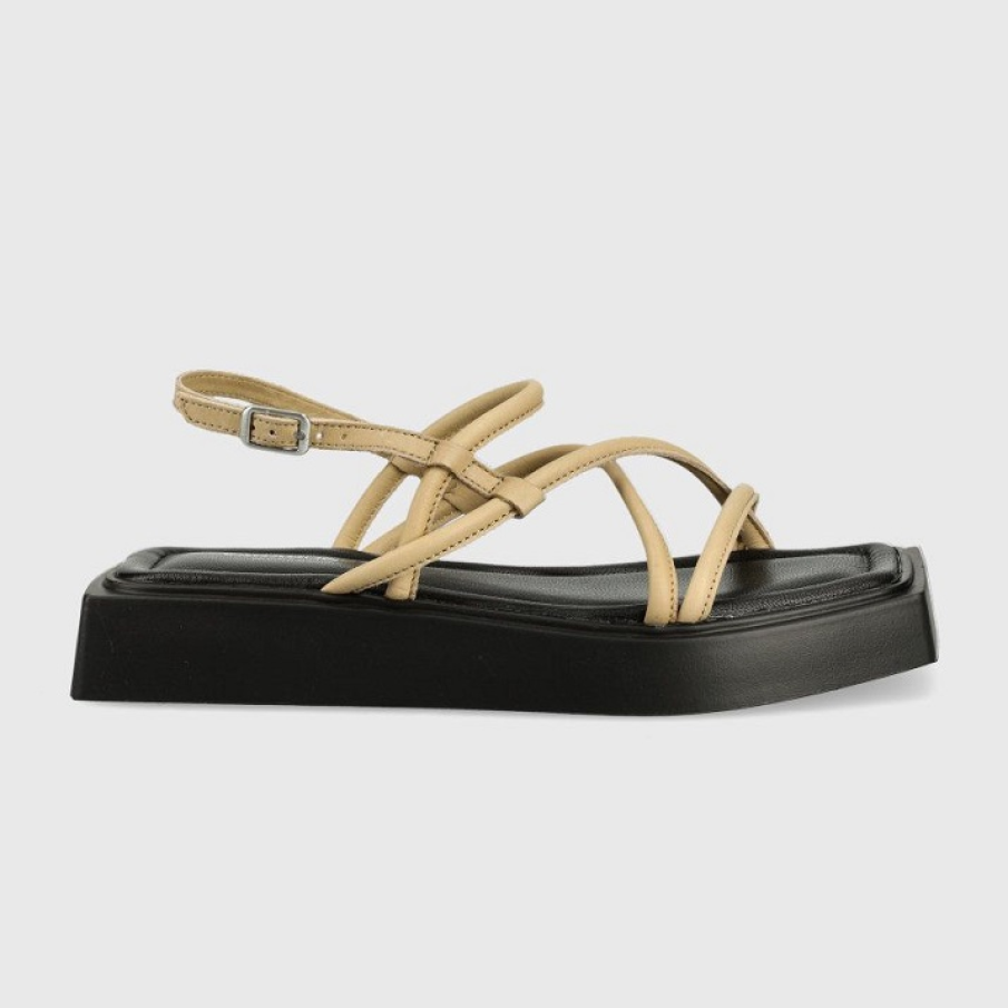 Sandale din colecția Vagabond cu talpă stabilă tip platformă. Bretelele sunt într-o nuanță plăcută de bej, iar talpa lată este neagră. 