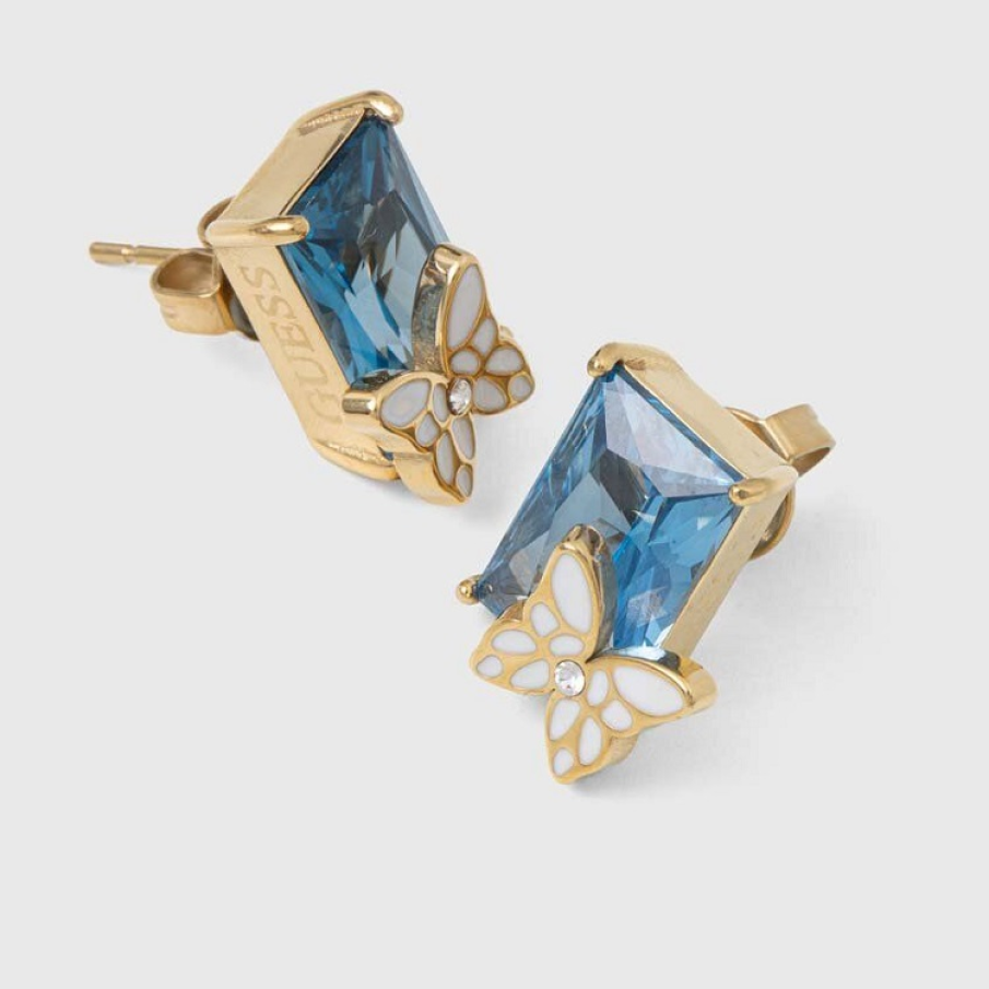 Cercei aurii Guess din oțel inoxidabil cu piatră semitransparentă albastră și elemente decorative tip fluturași 